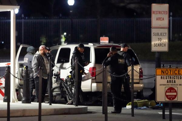 U.S. Secret Service police investigate near a vehicle that hit a security barrier at a entry point for the White House complex Monday, Jan. 8, 2024