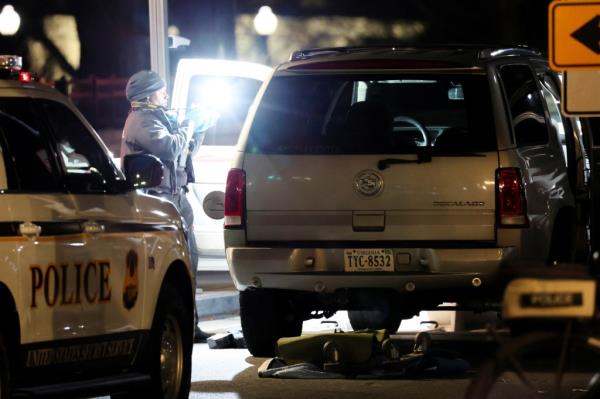 A member of the U.S. Secret Service works at the site of the vehicle crash.