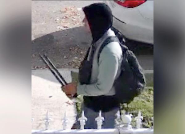 The accused attack is seen carrying the suspect weapon in his hands