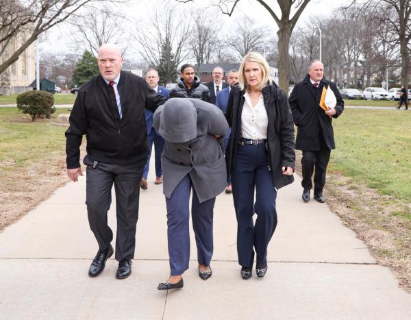 People board a bus after being evacuated from a train further south of the crash.