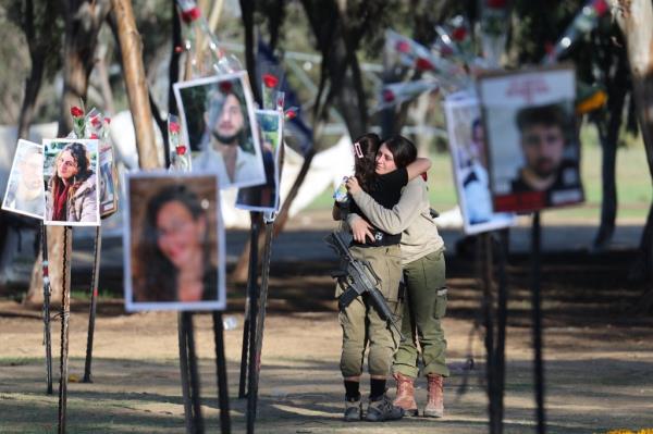 Pictures of some of the slain Nova festival goers in a memorial at the site.