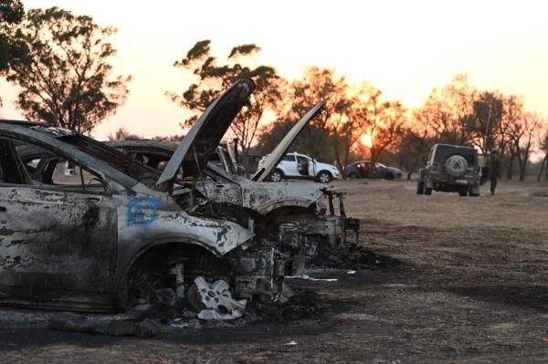 Burnt out cars that remained at the site of the festival attack.