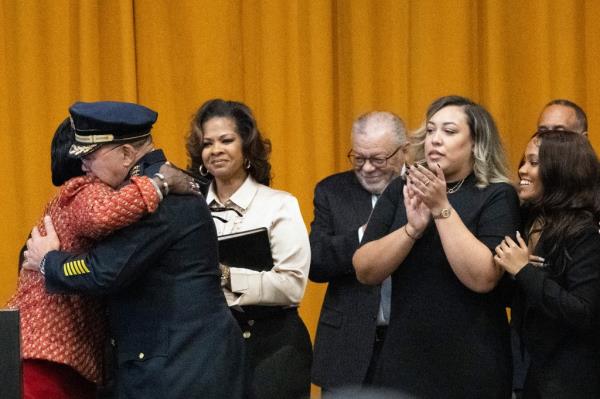 Philadelphia Mayor Cherelle Parker, left, embraces the city's new Police commissio<em></em>ner Kevin Bethel during a swearing ceremony.