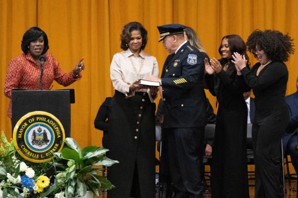 Newly sworn-in Philadelphia Mayor Cherelle Parker, left, swears in Police Commissio<em></em>ner Kevin Bethel.