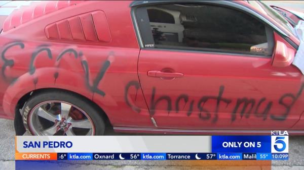 "Merry Christmas n----r" seen spray-painted on Reginald Scott's car