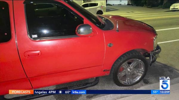 Reginald Scott's pickup truck seen with slashed tires on Halloween  