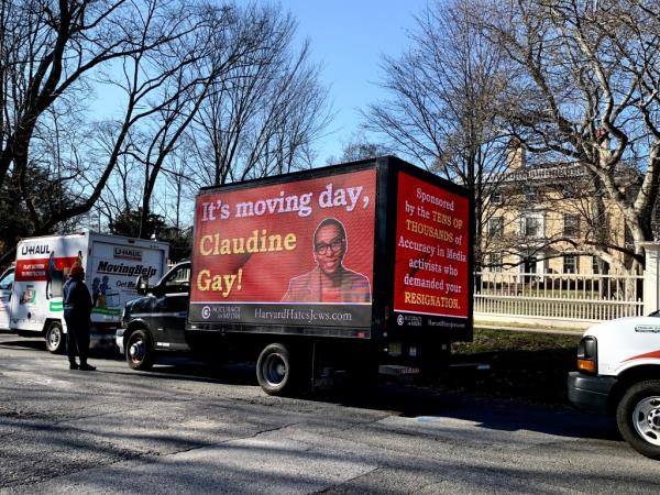 A Harvard doxxing truck was parked in front of the university saying "It's moving day, Claudine Gay!"