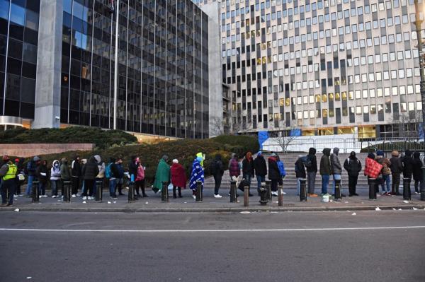 Newly arrived migrants co<em></em>ntinue to lineup outside of the immigration services building, Federal Plaza, in lower Manhattan.