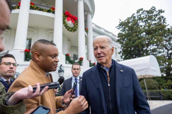 Joe Biden talks to the press before boarding Marine One on the south lawn of the White House on December 23, 2023.