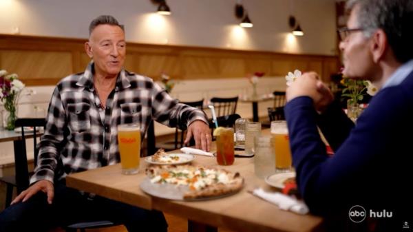 Bruce Springsteen in a diner talking. 