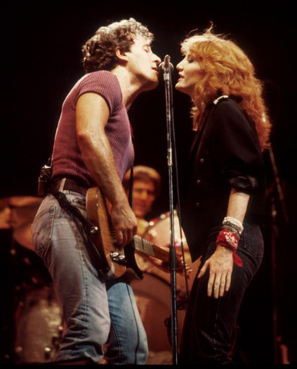 Bruce Springsteen and Patti Scialfa with E Street Band perform in 1984. 